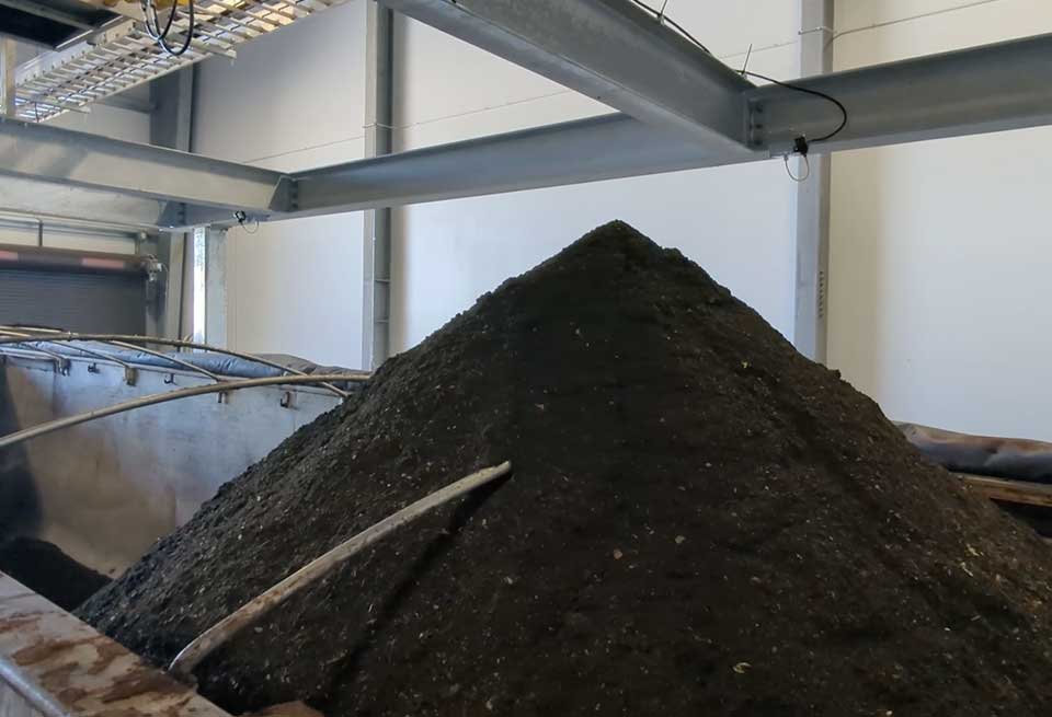 a pile of rich, thick, healthy soil amendment at an anaerobic digestion facility